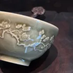 Plum Blossom Carved Ash-Green Handshake Cup